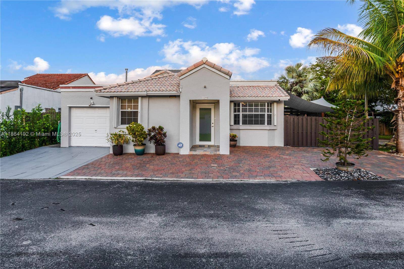 Welcome to this beautifully updated corner home featuring a paved driveway and excellent curb appeal.