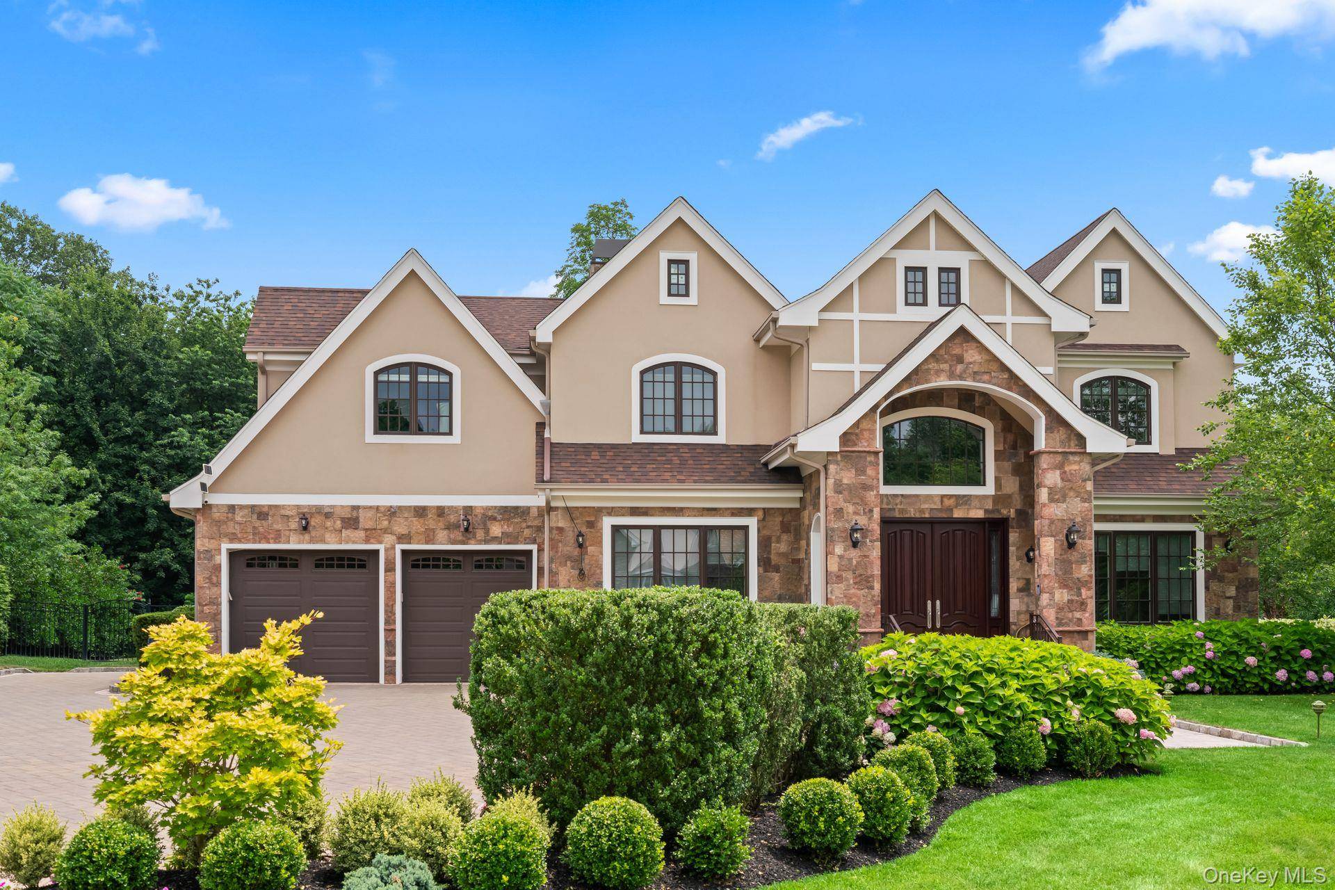 Welcome to 11 Buckingham Ct an exceptional Colonial style residence in the prestigious gated community of Stone Hill, Muttontown.