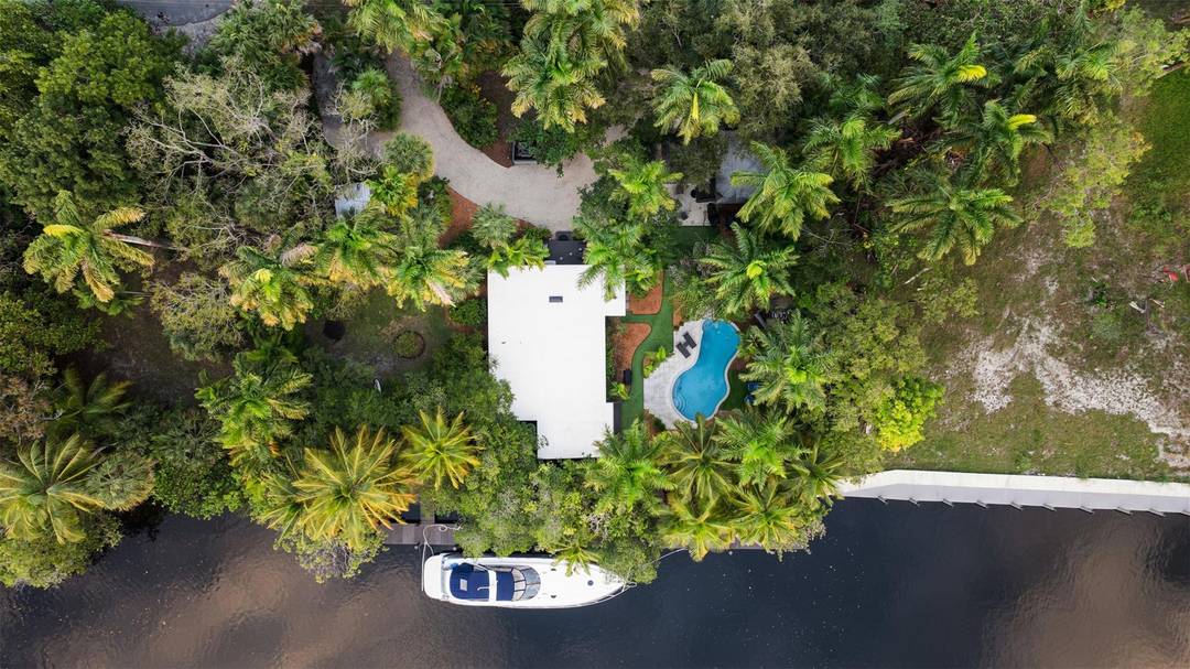 Waterfront single family home operating as a successful Airbnb with deep water ocean access, NO FIXED BRIDGES, ideal for boat owners and investors.