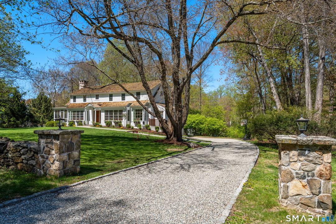 Tucked at the end of a coveted Hunt Club lane, 10 Sprucewood Lane offers exceptional privacy, architectural refinement, an enviable setting within one of Westport's most sought after neighborhoods.