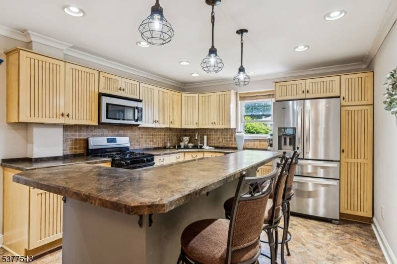 Experience exquisite living in this meticulously maintained 4 bedroom, 2 family gem.