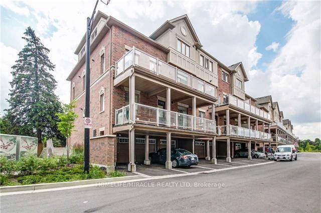 Spacious Executive Town Home with 2 Bedroom Plus Den and 3 Washrooms In Prime Location.