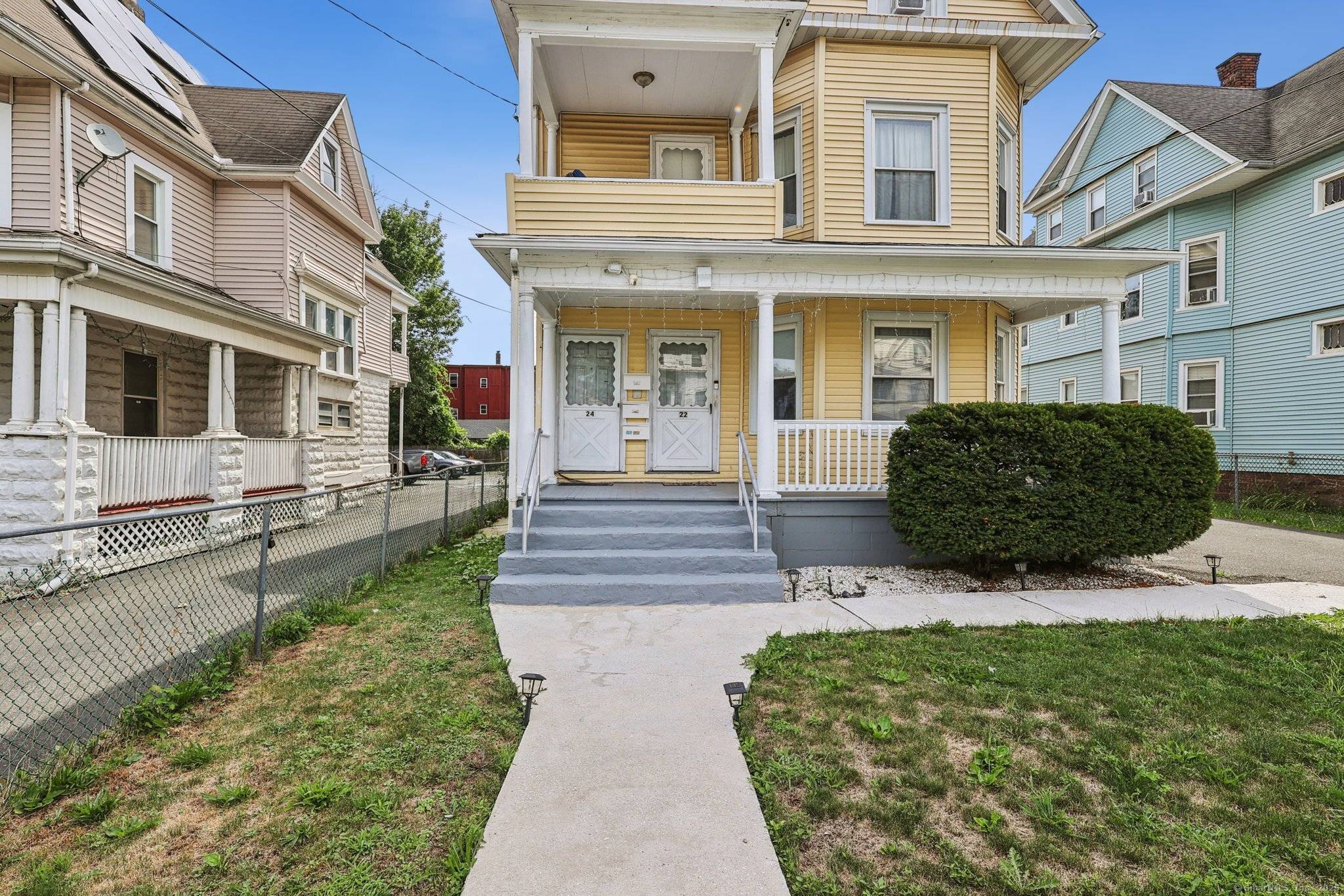 Step inside this classic three family home in Hartford, where timeless charm meets everyday convenience.