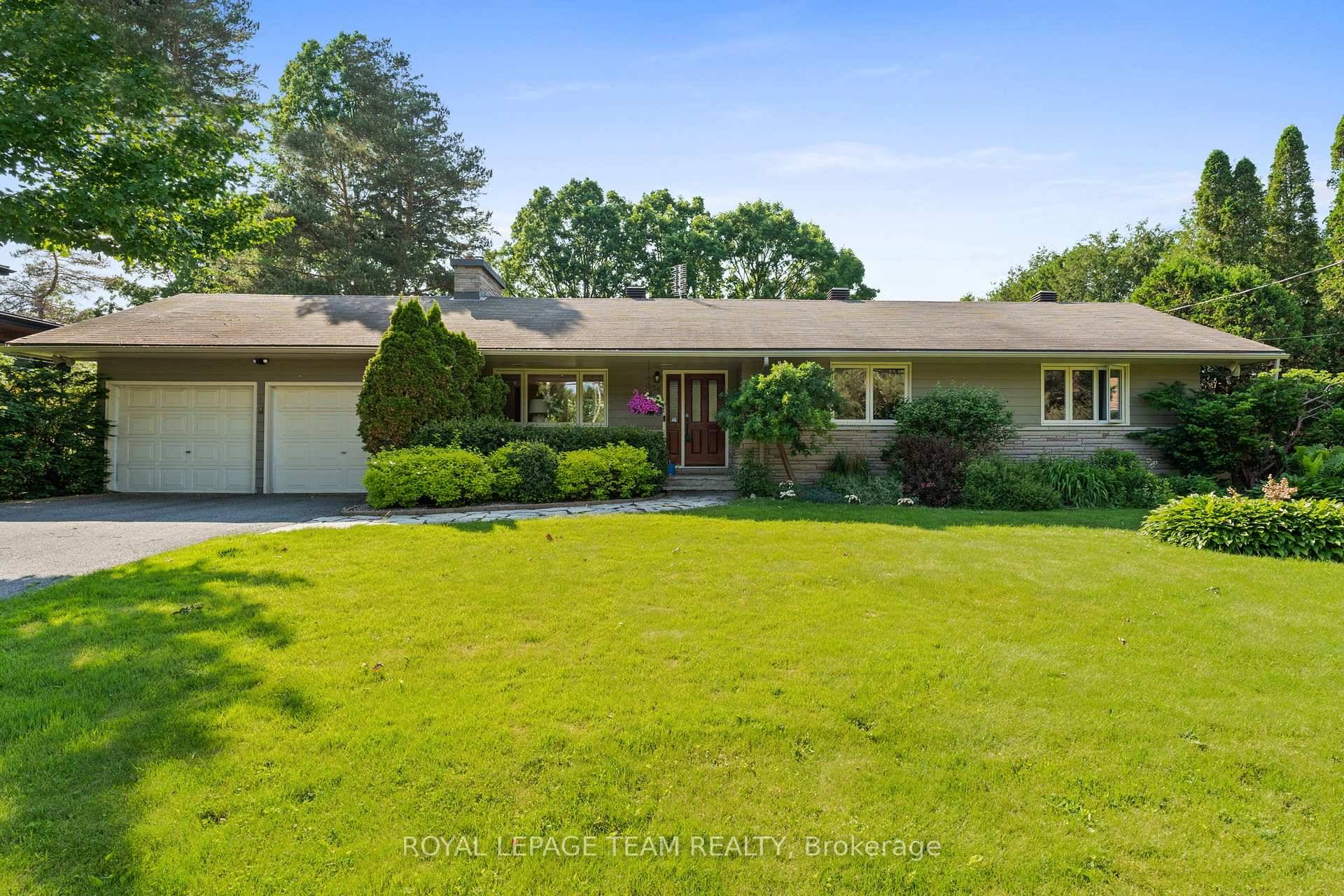 Located in the established subdivision of Honey Gables, this thoughtfully maintained waterfront bungalow offers a scenic setting along the Rideau River.