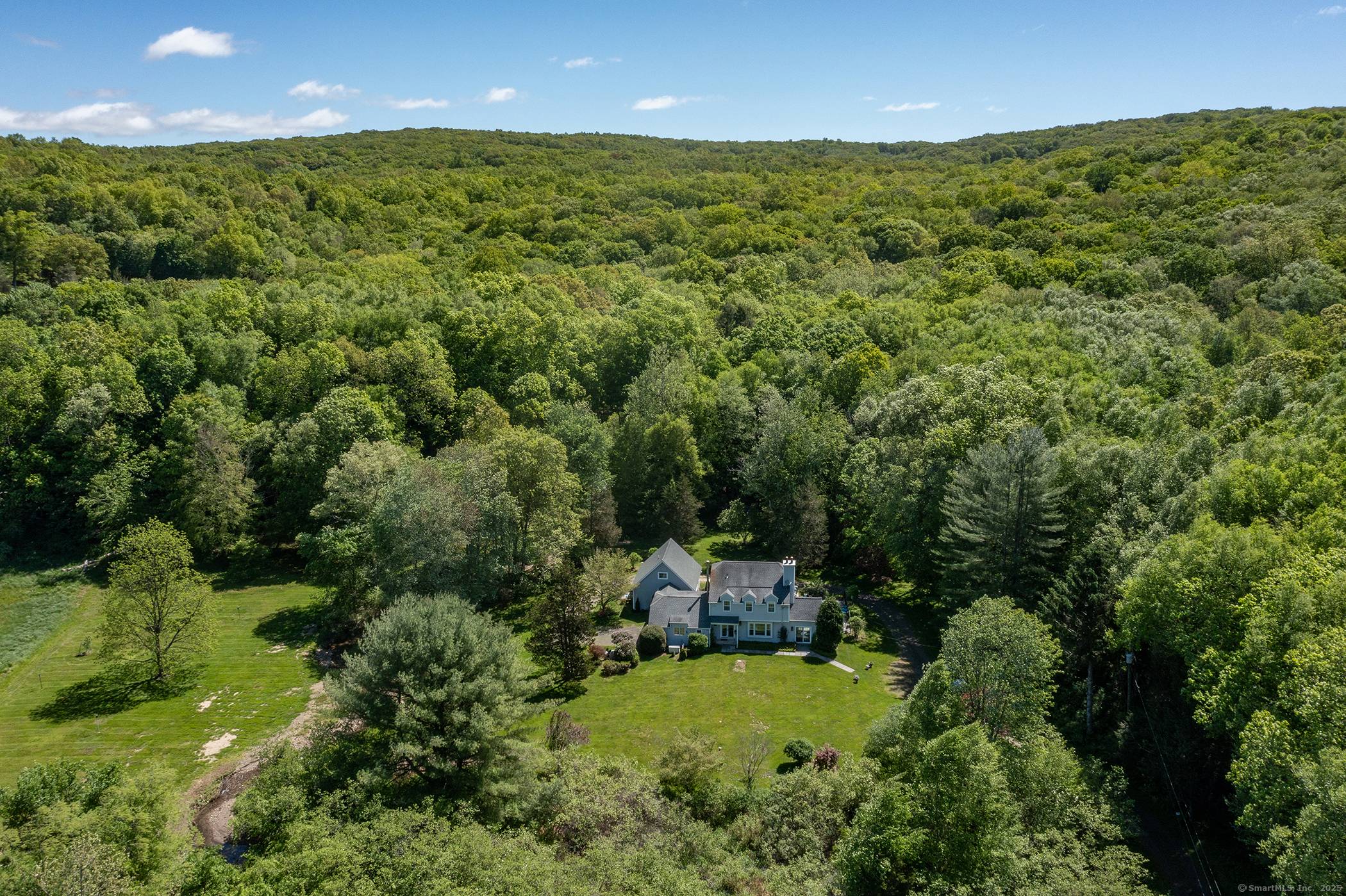 Discover this charming 4 bedroom Colonial with 1 additional bedroom is attached in law apt on the southern side of Roxbury, offering an idyllic escape with seamless access to NYC.