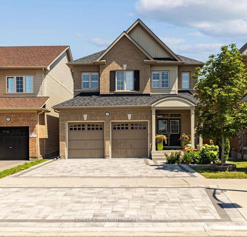 Welcome to this elegantly landscaped, masterfully crafted Tribute home in the sought after Winfield's community.