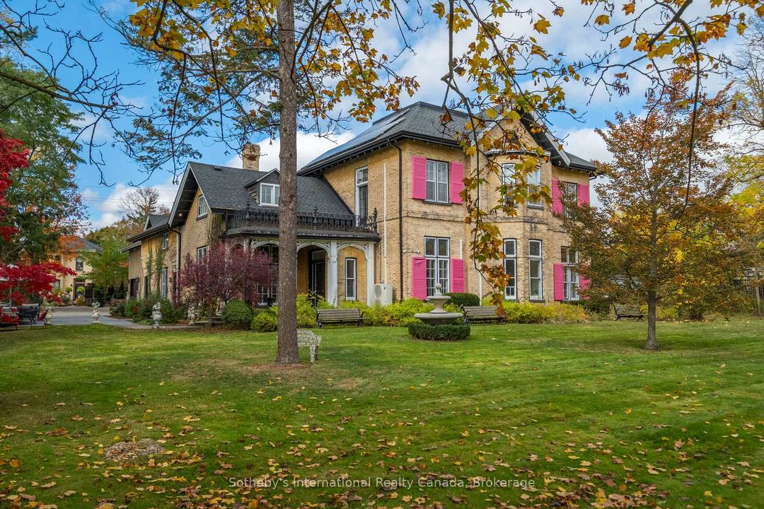 Perched gracefully above the Grand River, the storied Baird House circa 1860s stands among Paris's most distinguished heritage residences.