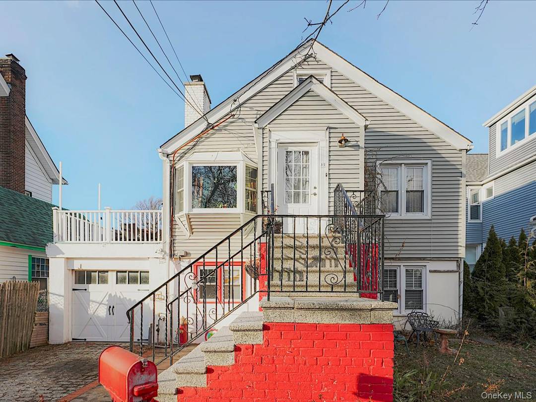 Two family water view property offering exceptional versatility and income potential in the heart of City Island.