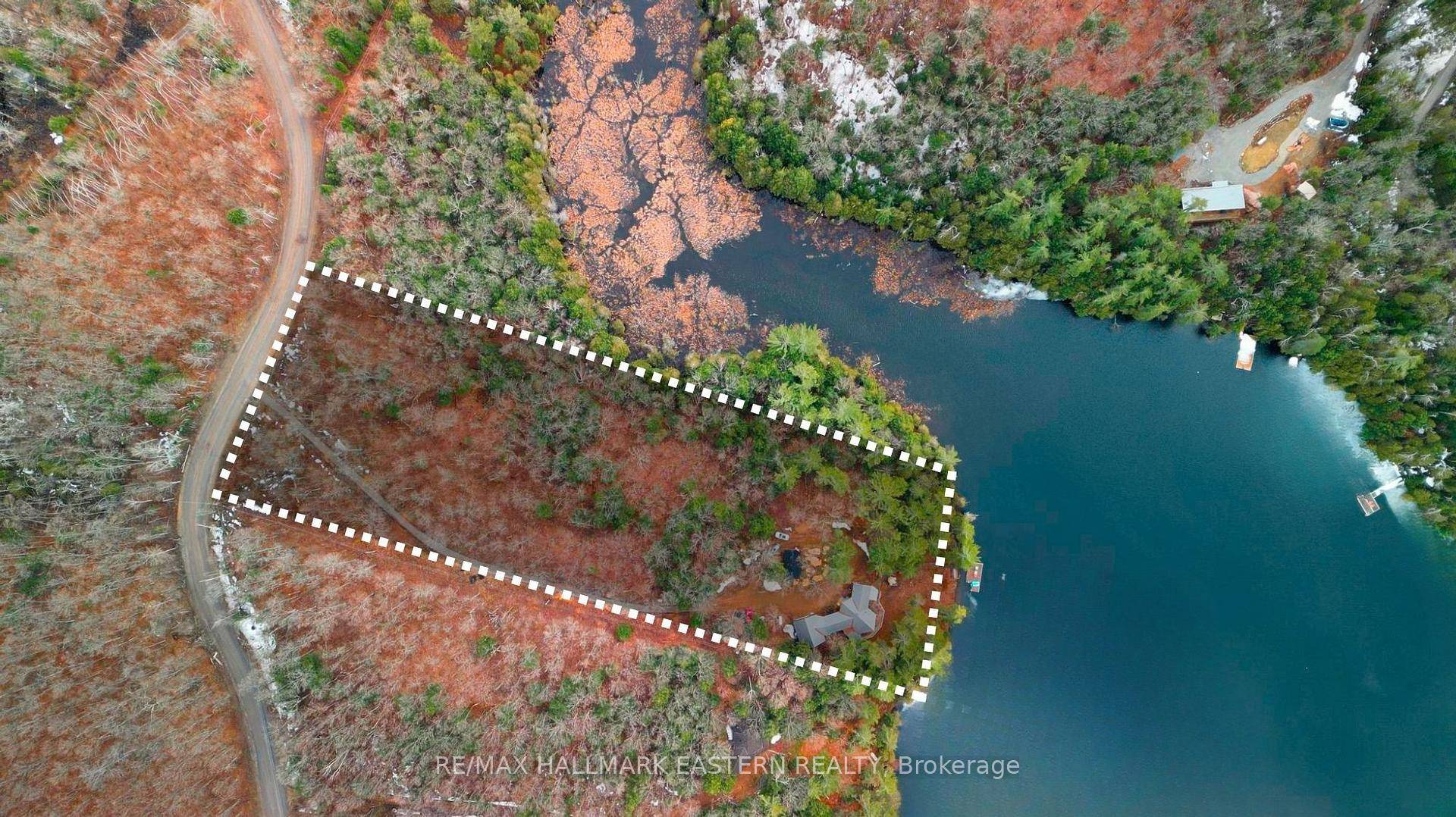 Set on over 5 private, forested acres with 260 feet of waterfront, this stunning property seamlessly blends tranquility and adventure.