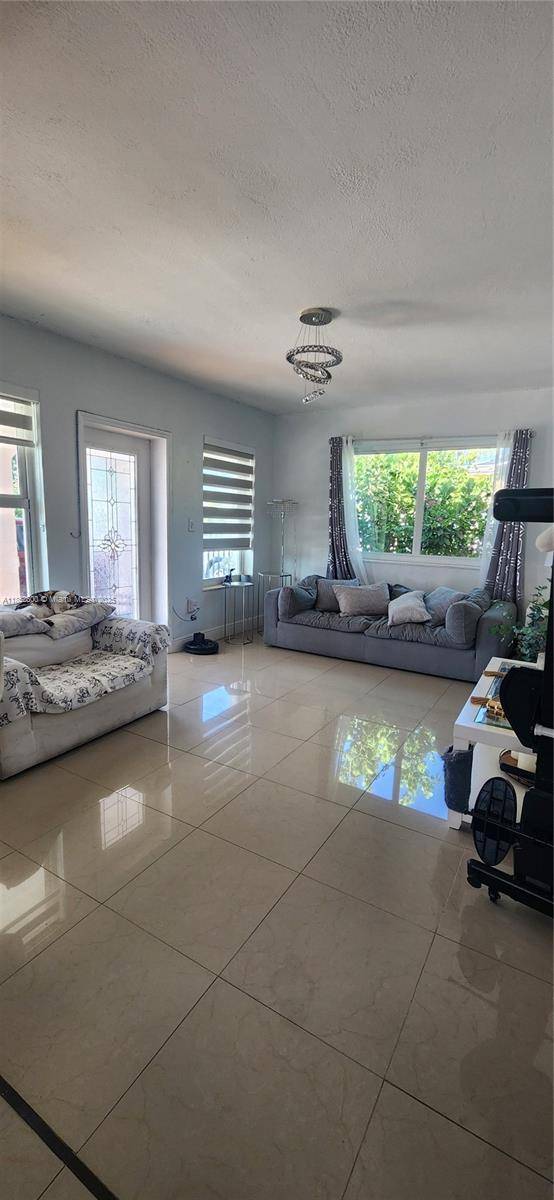 Discover this beautifully remodeled corner lot home in the heart of Hialeah.