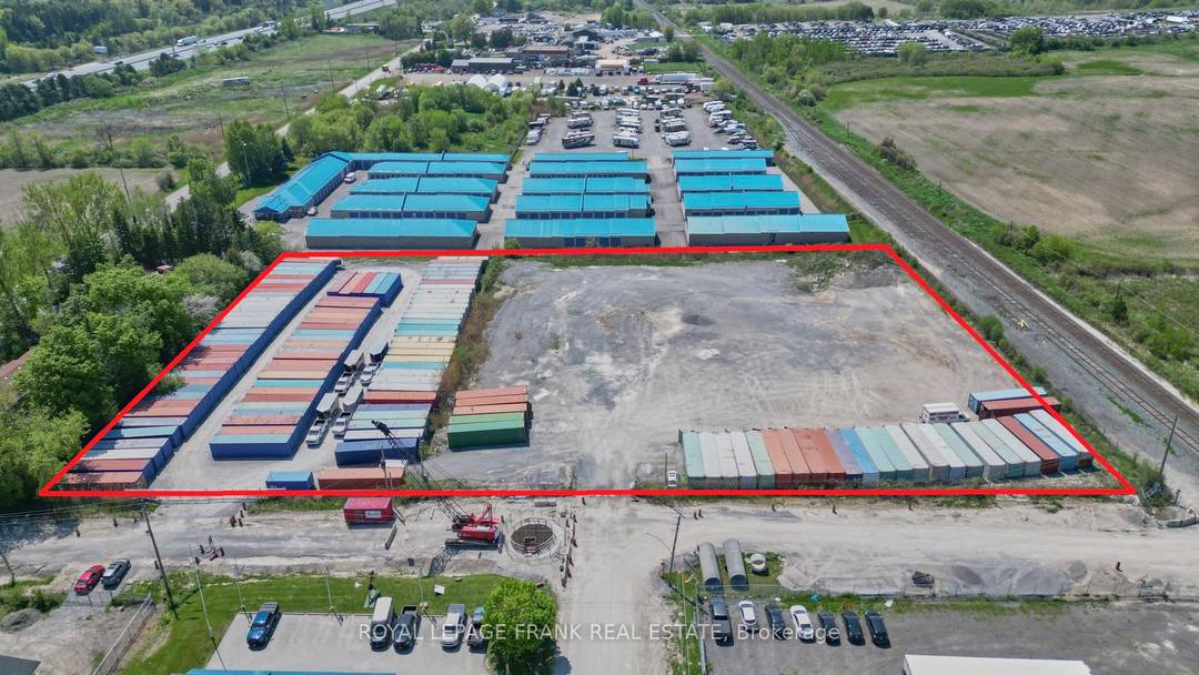 Four acres, clean yarded amp ; fenced M2 outside storage land over 530 feet of frontage, 2 existing entrances, with municipal services at the road.