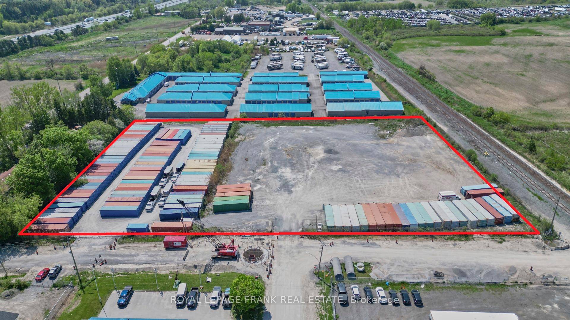 Four acres, clean yarded amp ; fenced M2 outside storage land over 530 feet of frontage, 2 existing entrances, with municipal services at the road.
