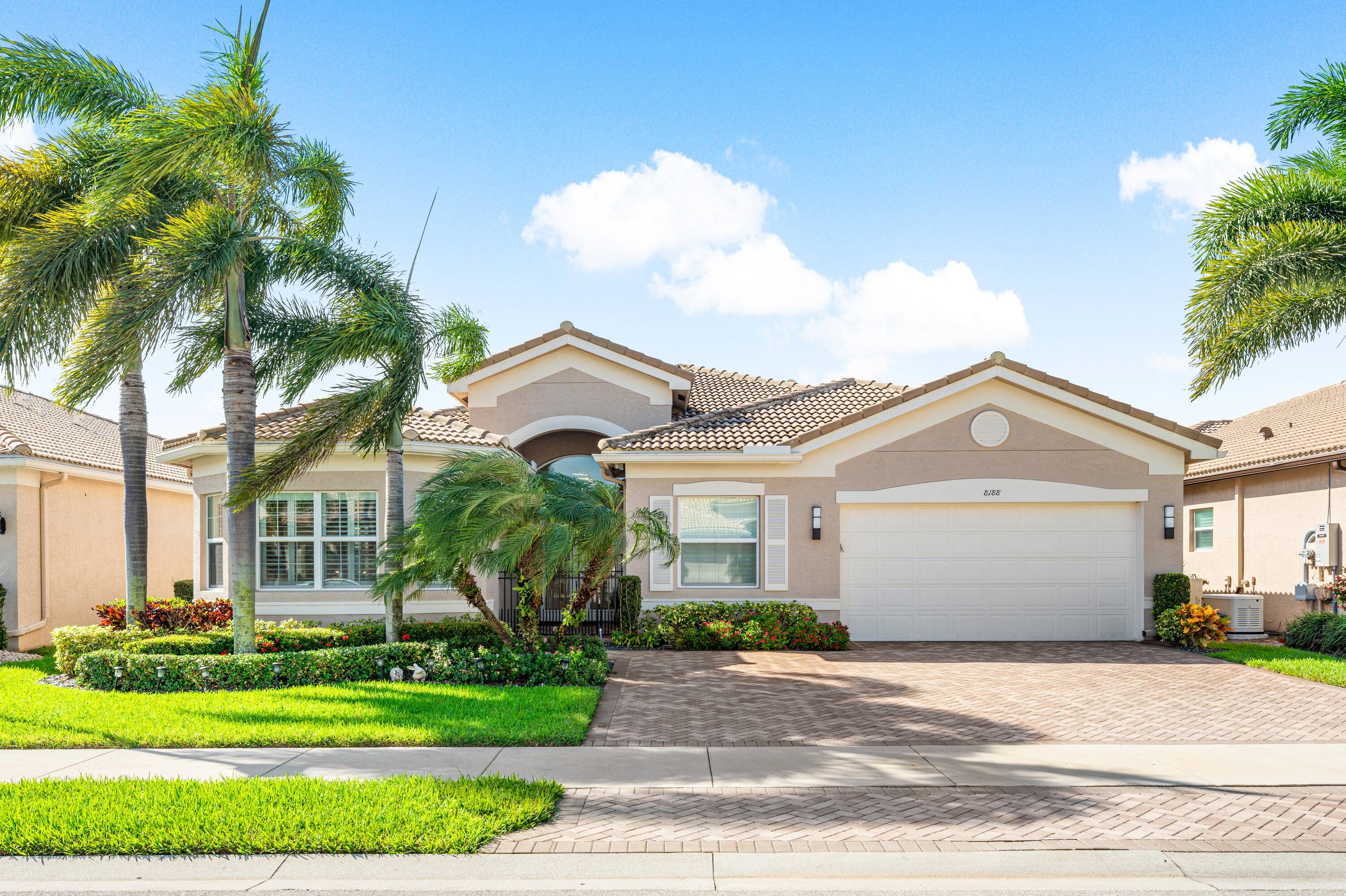 Custom Julia model on beautiful lakefront lot backing east.