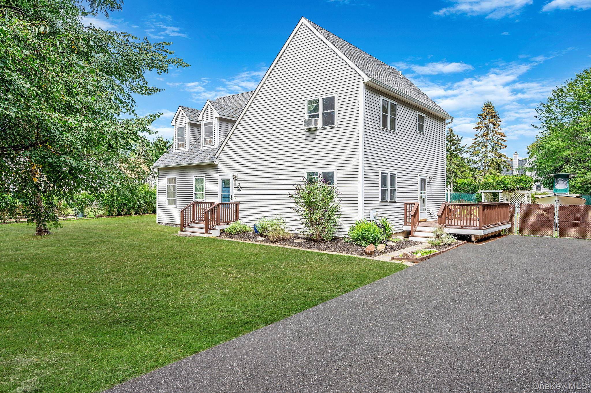 Nestled in a serene and charming community, this stunning four bedroom home combines comfort and style throughout.