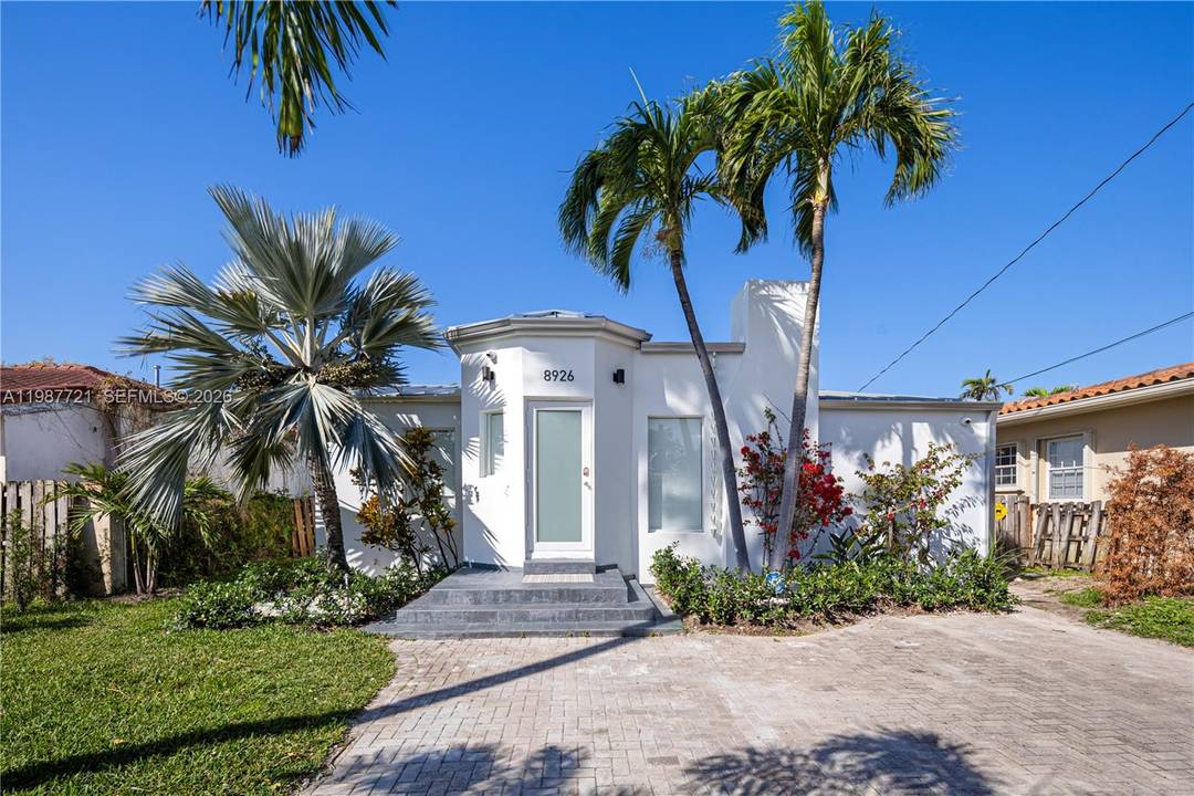 Beautiful home in Surfside with updated kitchen, featuring quartz countertops and new appliances.