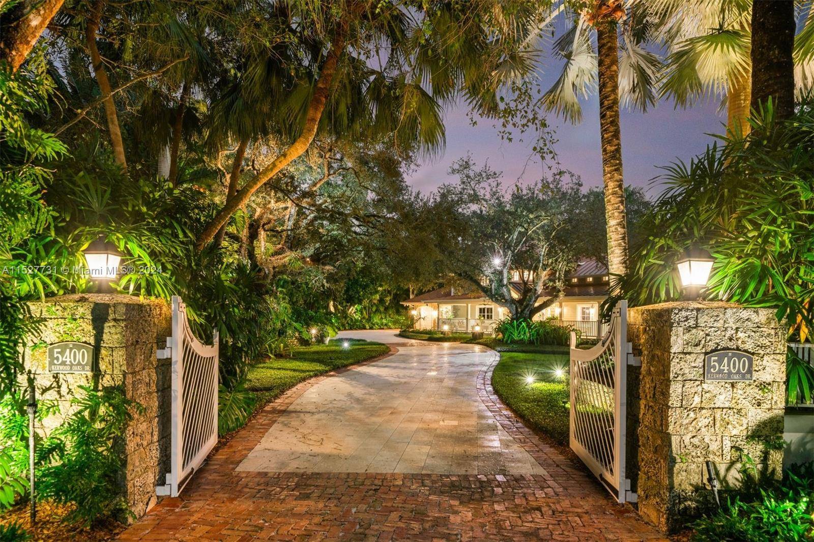 Located in the guard gated Banyan Lakes neighborhood, this 2003 custom Old Florida estate style home w wraparound porches spans 8, 765 SF is the epitome of sophisticated living.