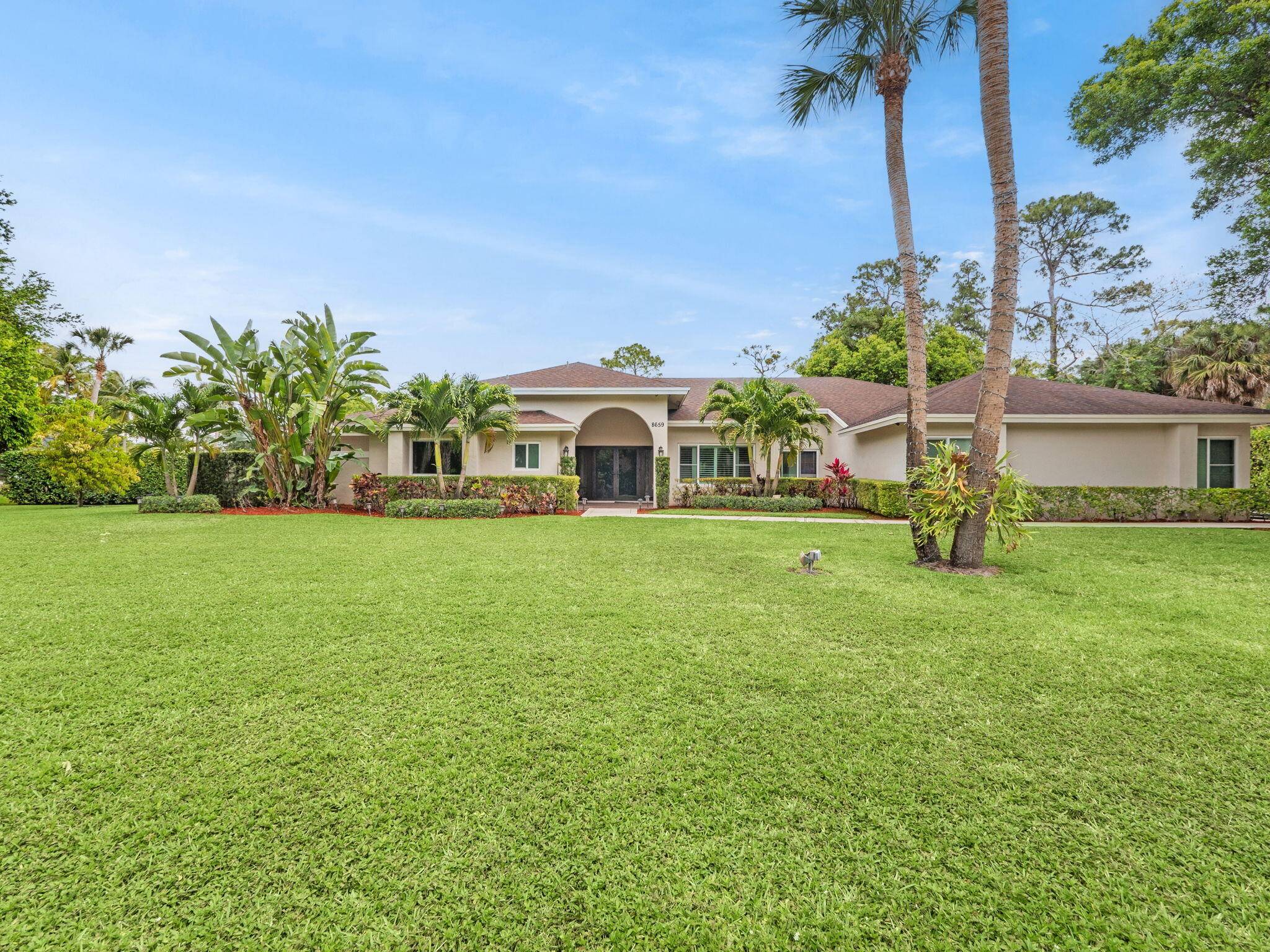 A rare opportunity in West Palm's coveted Thousand Pines this 4 bed, 3 bath estate on 1.