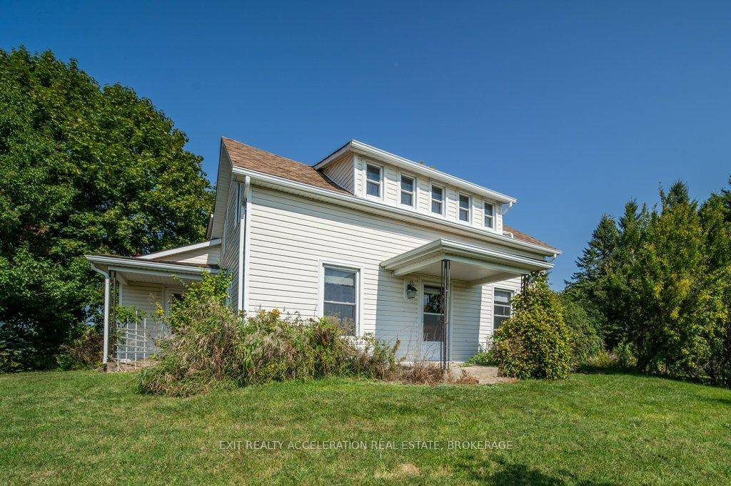 This charming 3 bedroom, 3 bathroom home, built in 1870, sits on 7 picturesque acres along the shore of Hay Bay.