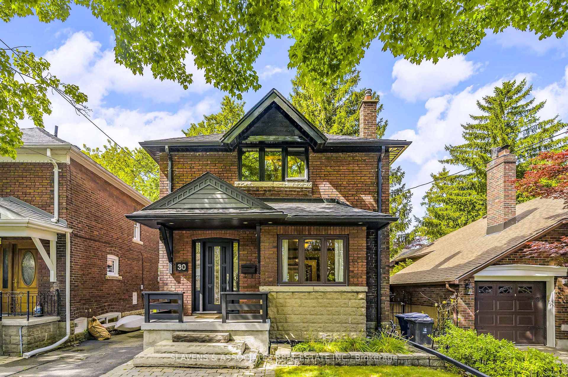 Welcome to this beautifully renovated detached family home with parking, just steps from the lake in one of the city's most sought after neighbourhoods.