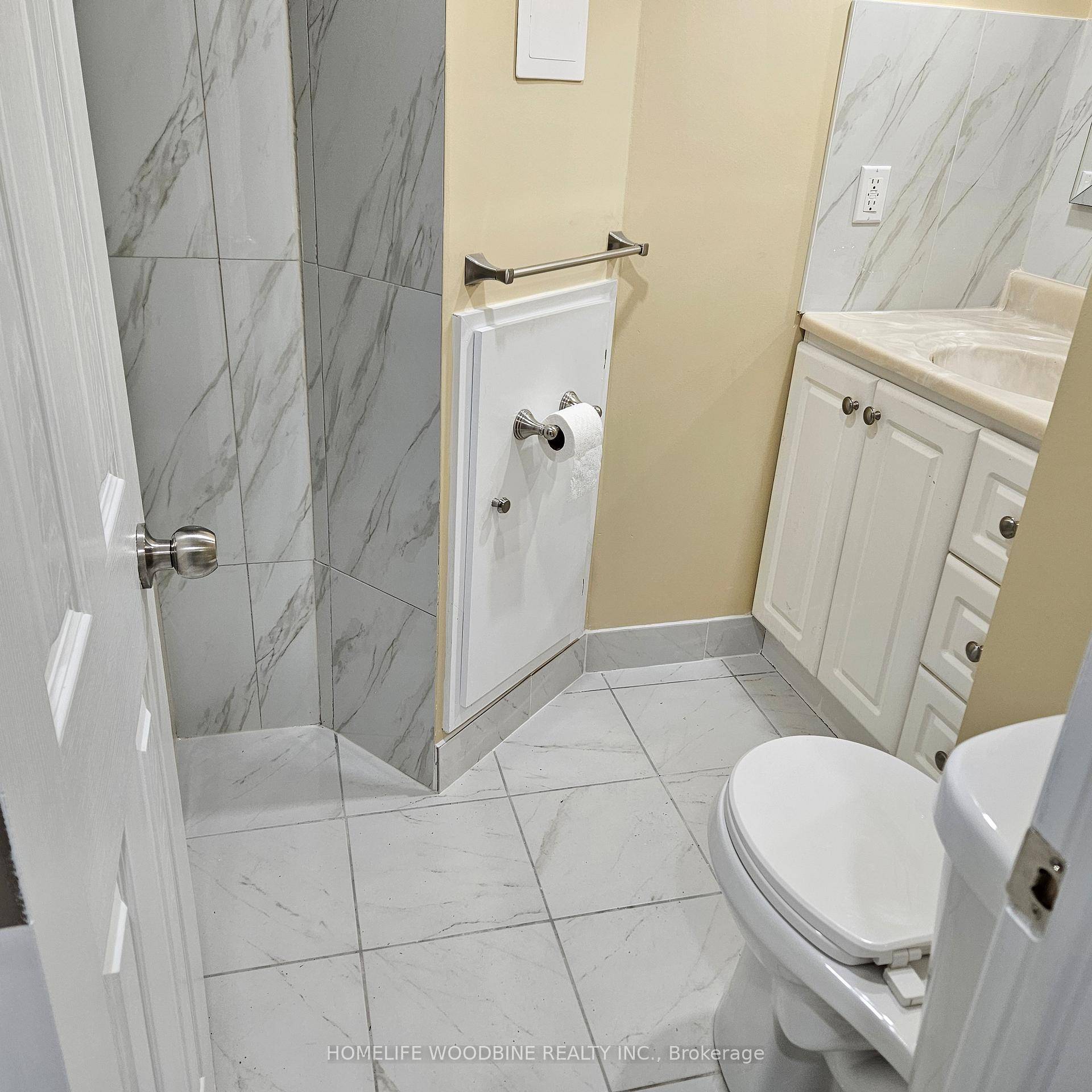 Newly Renovated Three Bedrooms, 2 Bathroom Basement Apartment with Separate Entrance features Laminate Flooring Throughout.