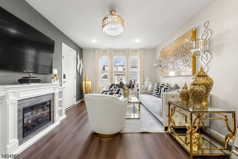 Welcome to this exceptional and meticulously maintained two family home offering space, comfort, and versatility.