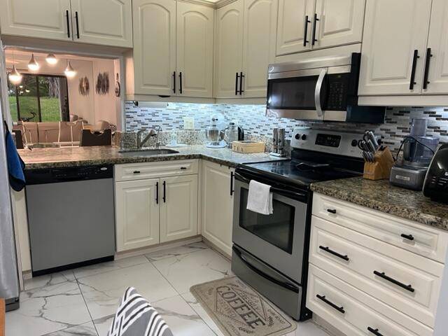 MOTIVATED SELLER Renovated Kitchen, New Tile Floor, New bathrooms, 1, 150 Sq Ft, First Floor, Large Front Patio Fully Fenced.