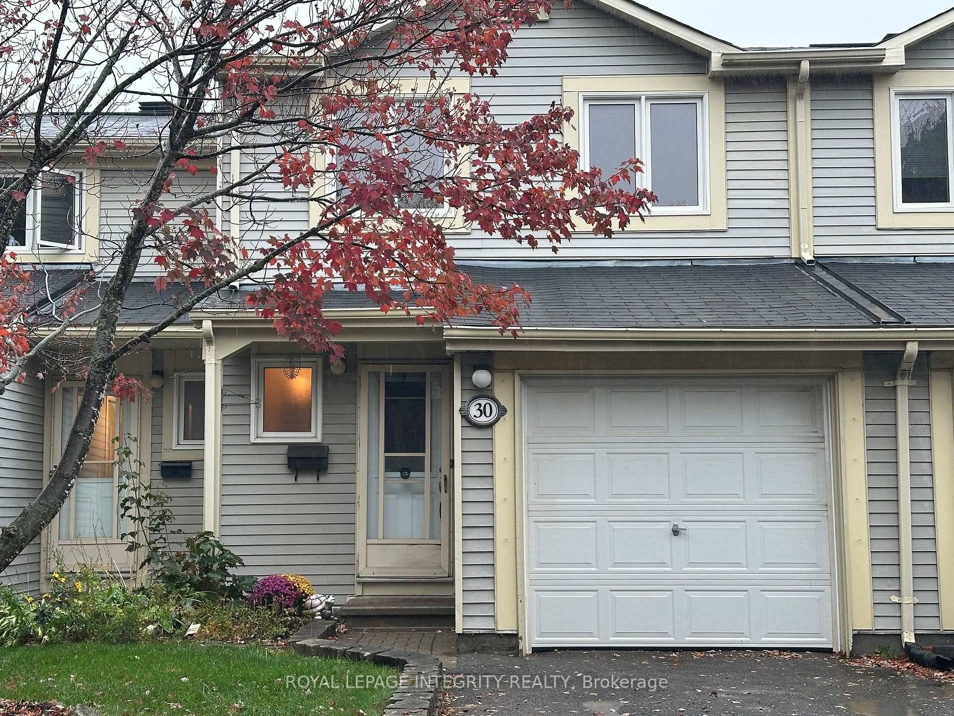 Welcome to this updated 3 bedroom, 3 bath condo with attached garage in the heart of Katimavik.