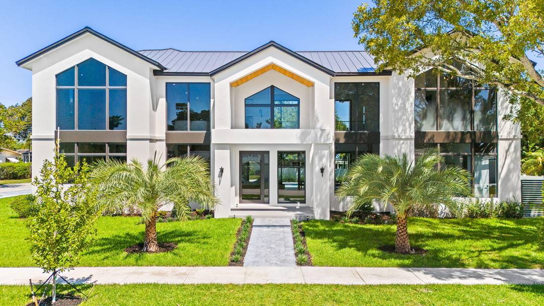 Located in prestigious Coral Ridge, this stunning new construction two story home sits on an oversized corner lot and offers 4, 752 sqft of refined living.