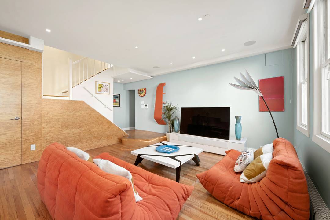 This stunning loft like triplex offers an unusually private and sun filled living experience in the heart of the East Village.