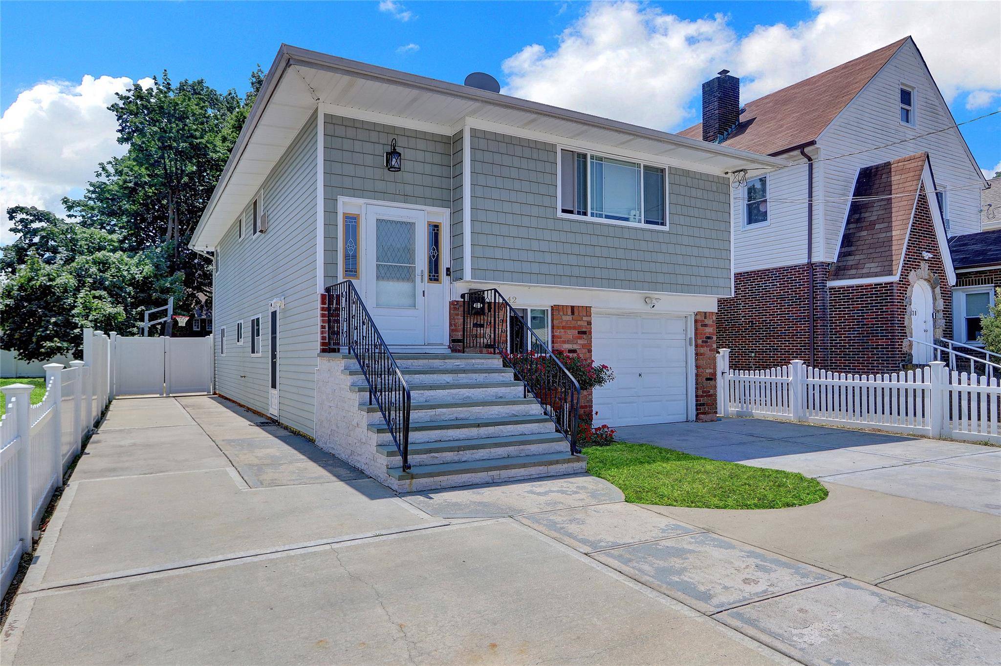 Welcome to 42 Peters Ave, Hempstead, NY Spacious, Updated Hi Ranch with Room for Everyone !