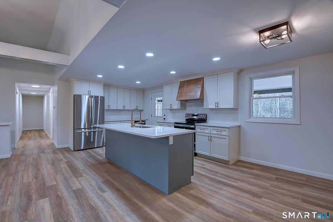 MOVE IN READY Welcome to this beautifully reimagined split level home, where classic design meets modern living in a peaceful neighborhood.