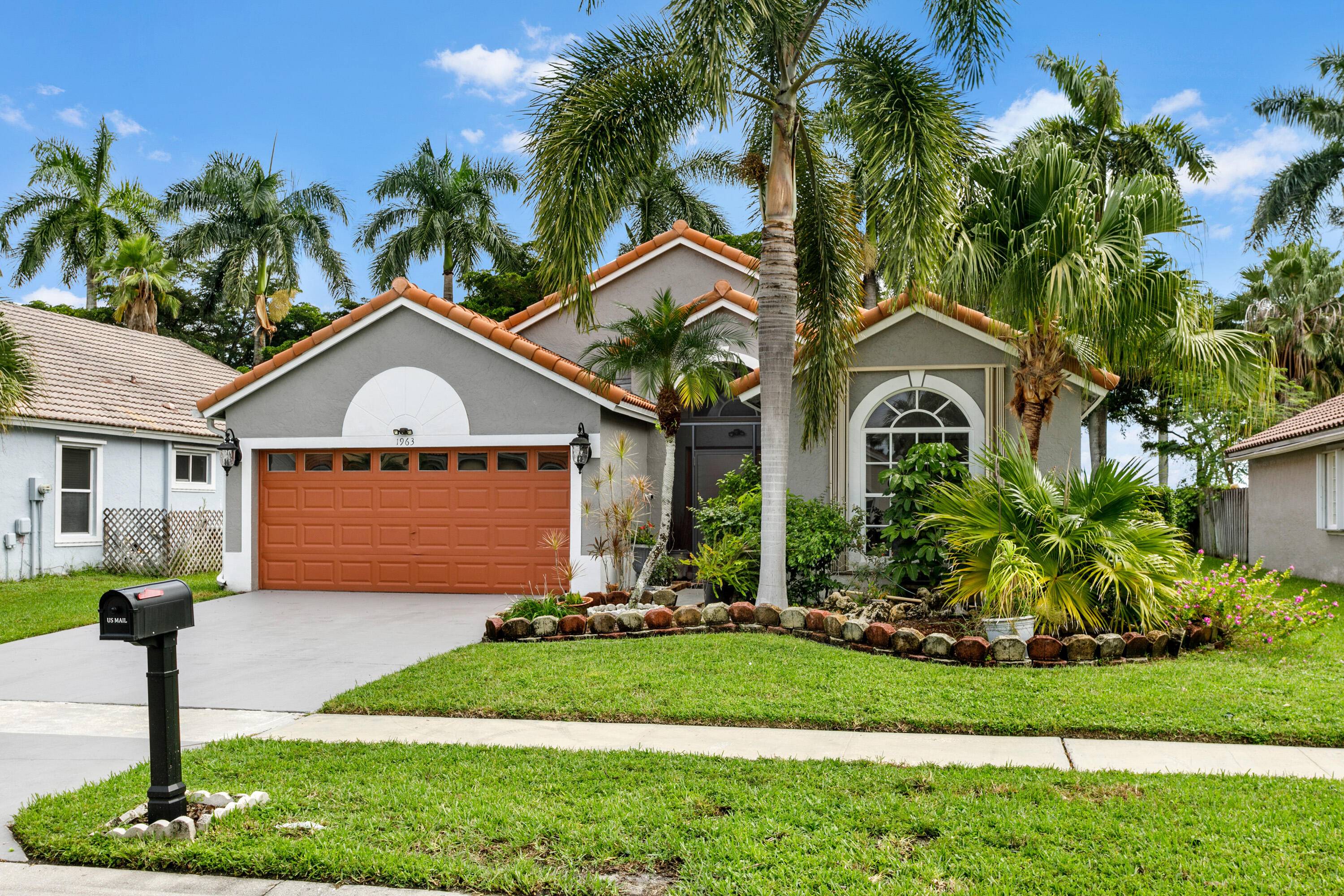 This lovely pool home, located in the gated community of Wellington Edge, is an entertainer's dream !