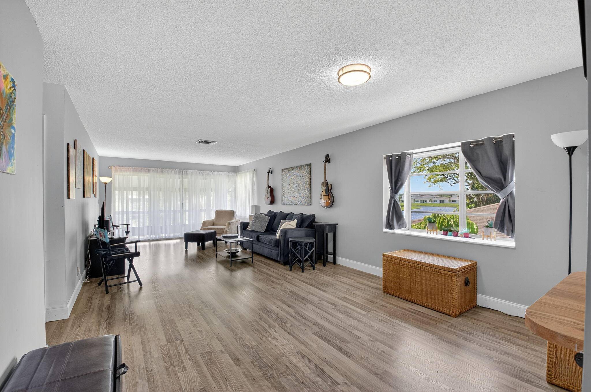 Serene Living in Palm Greens 2 Bedroom, 2 Bath Corner UnitWelcome to this beautifully situated 2 bedroom, 2 bathroom corner residence on the second floor, offering unobstructed lake and lush ...