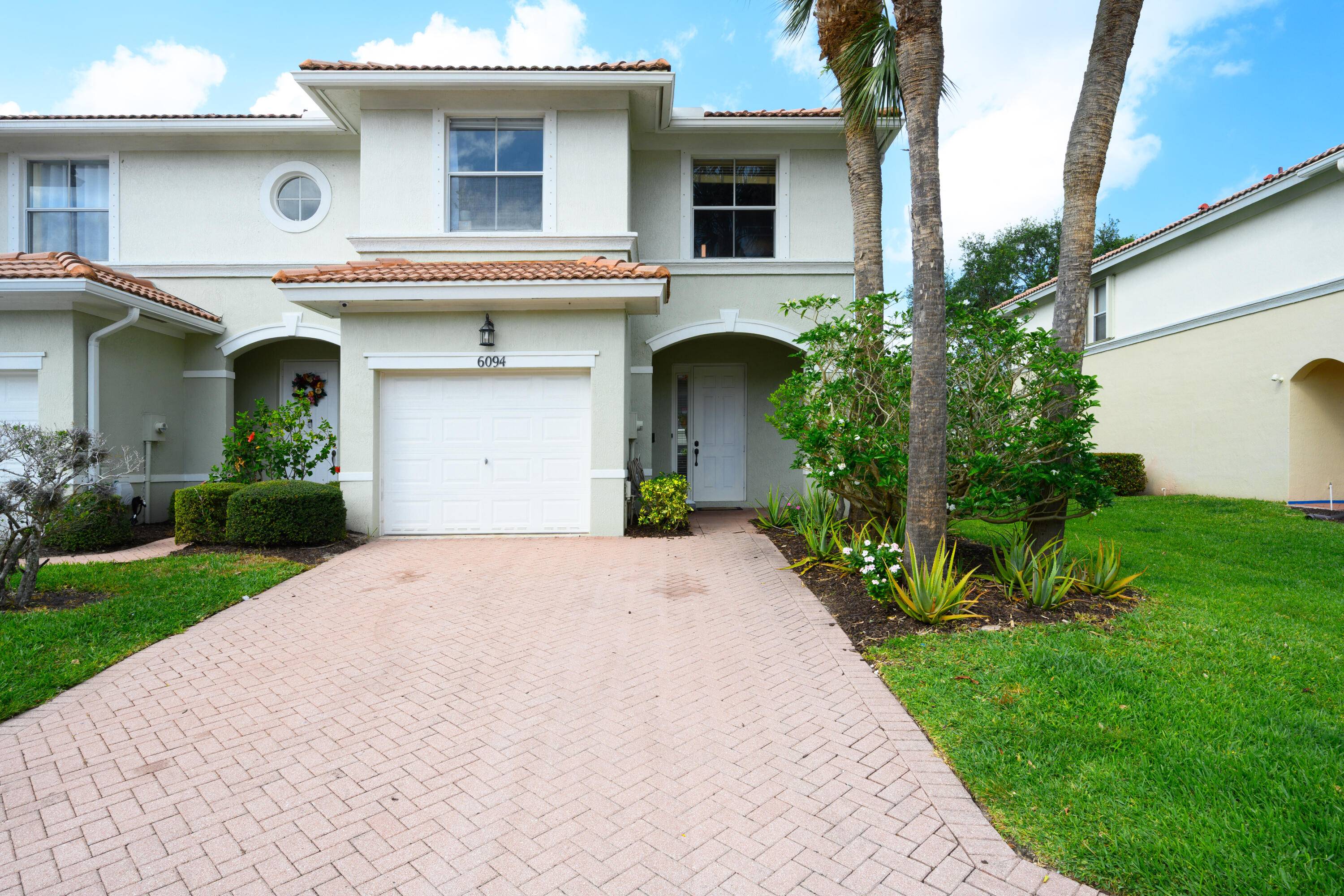 This beautiful end unit is located in a gated community.