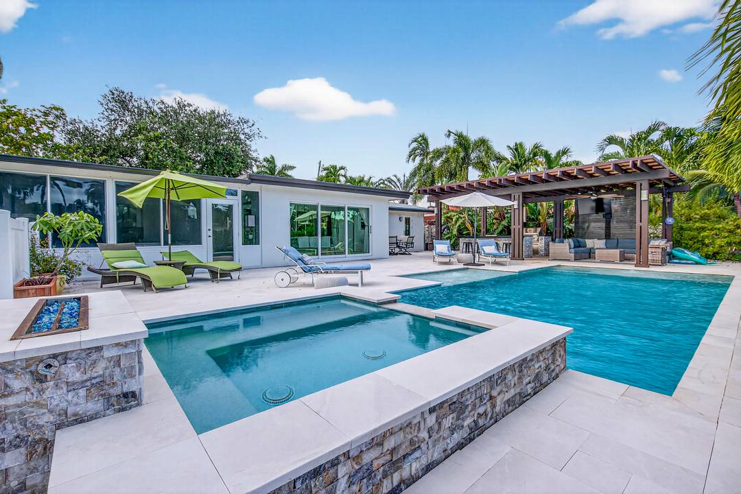 Exquisite 2 bed 2 bath waterfront pool home with a 2 car garage, located in the quiet Gated neighborhood of Bal Harbour, Fort Lauderdale !