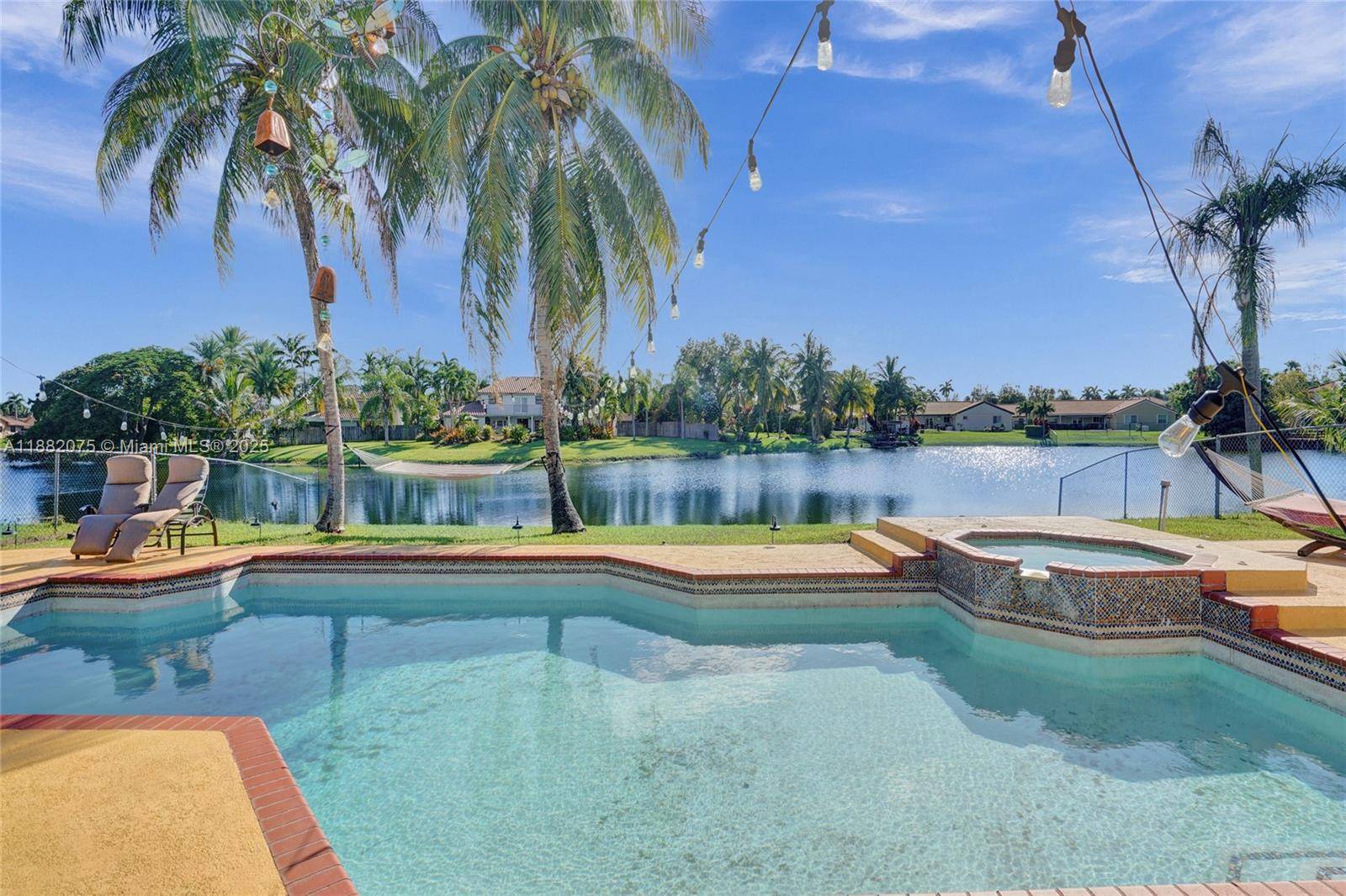 Lakefront living in this beautifully maintained 4 bedroom, 3.