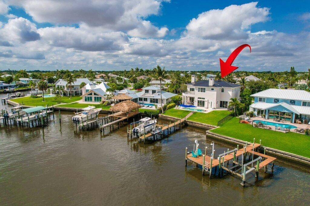 Welcome to an exceptional waterfront residence in the heart of Palm City, offering sweeping wide water views, direct ocean access with no fixed bridges, and a luxurious indoor outdoor lifestyle ...