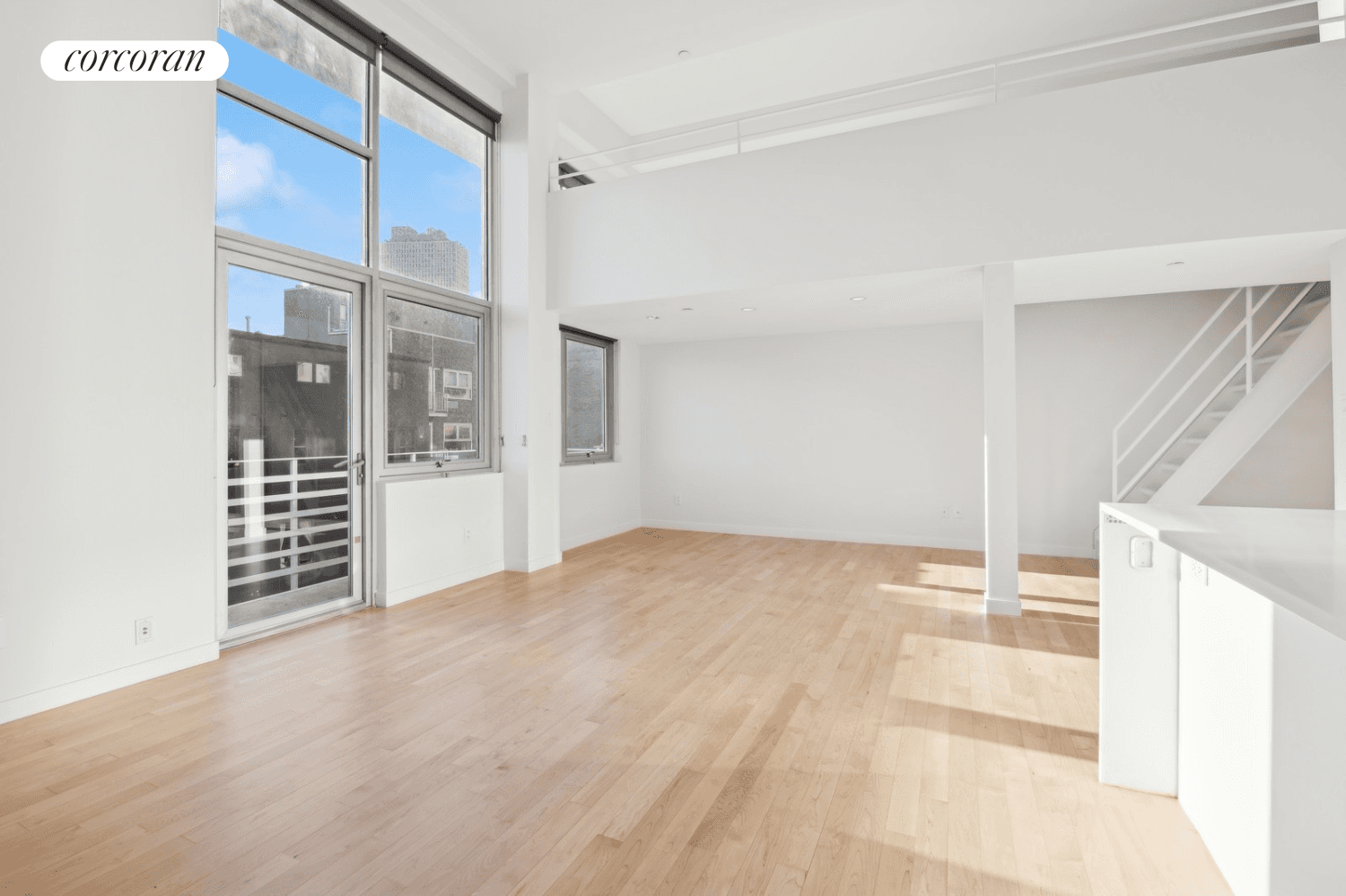 Your search for an authentic soaring, double height loft in the heart of Williamsburg's dynamic Northside with onsite parking, private storage and outdoor space ends here.