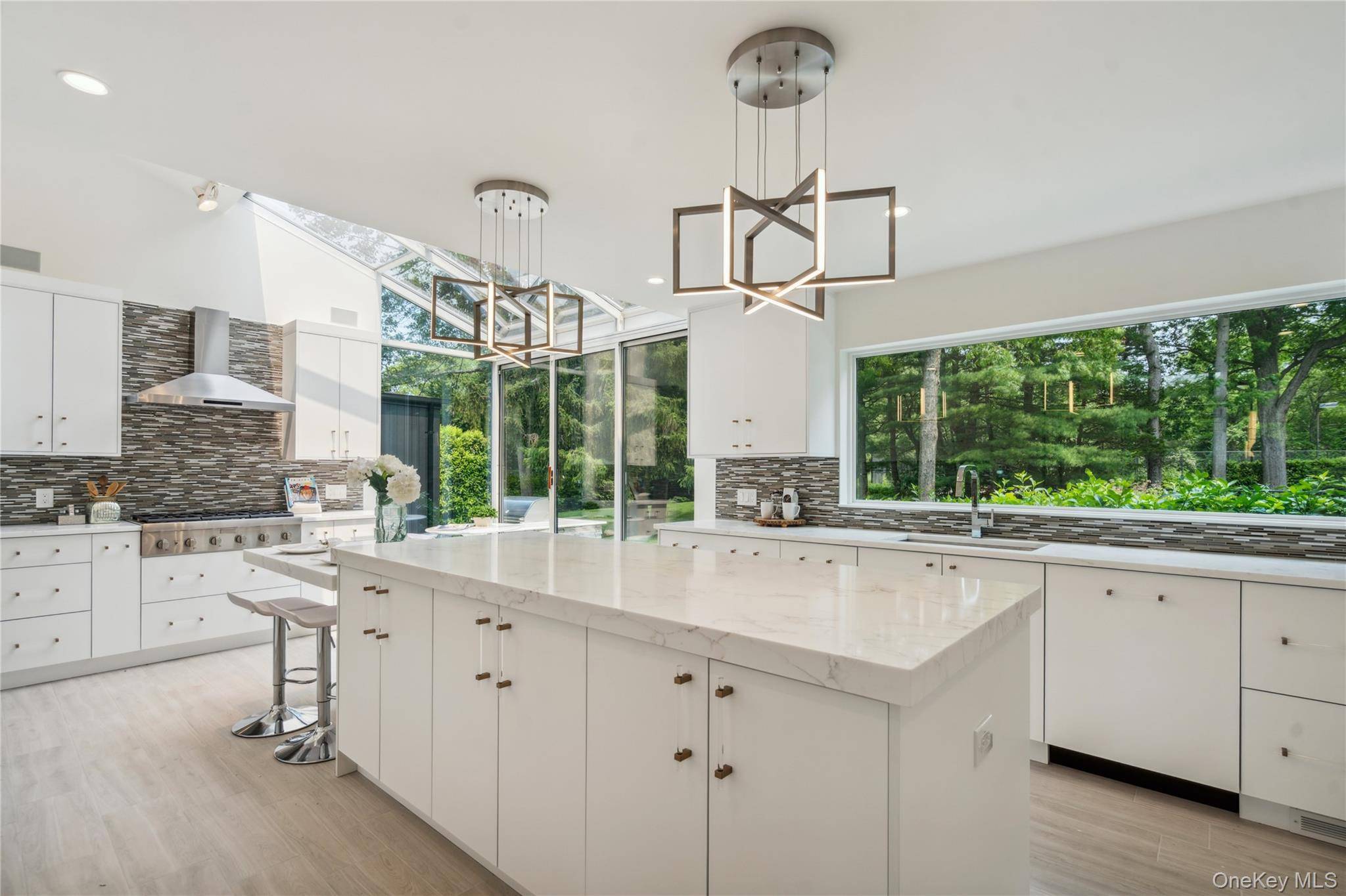 A stunning example of a custom designed home to enhance daily life with an open concept floor plan of primary living spaces and truly magazine worthy.