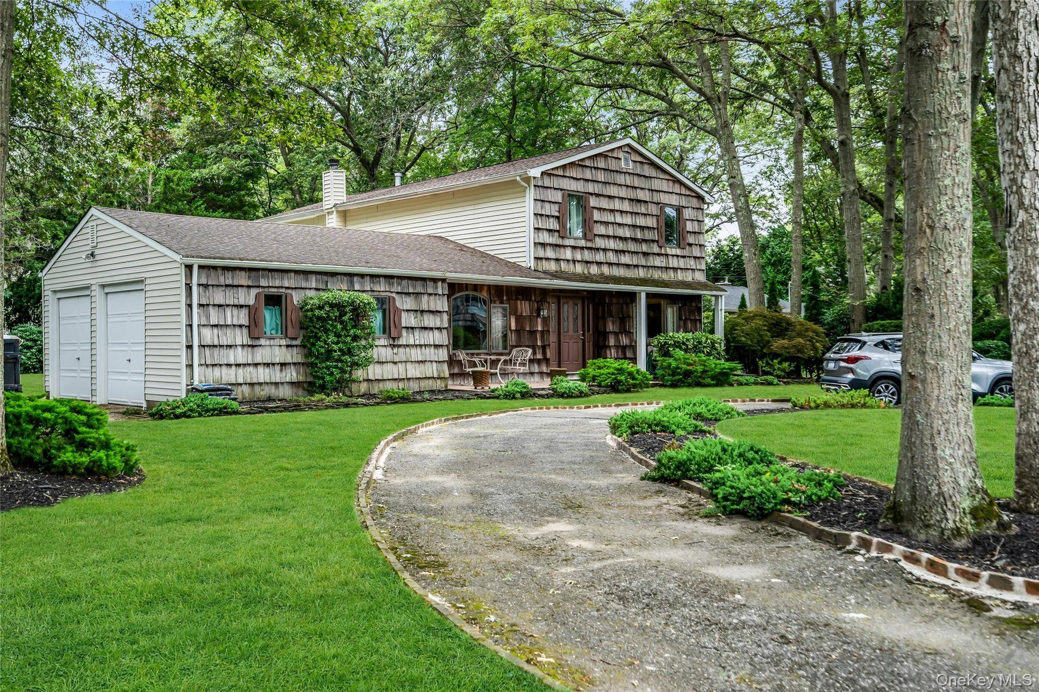 Expanded Colonial with Huge Family Room with Propane Gas Fireplace Laundry room Conveniently Located on 1st Floor Hardwood Floors Entertaining Wood Rear Deck 3 Generous Bedrooms and 2.