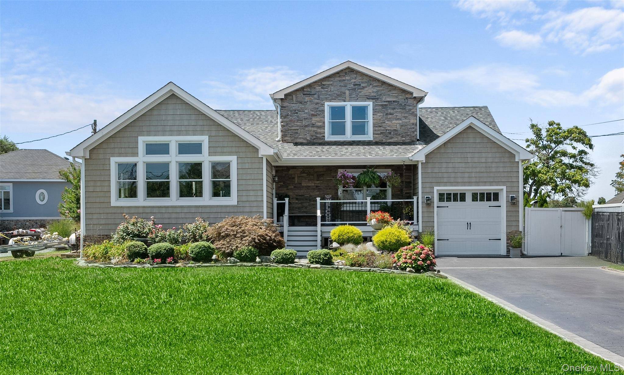 This stunning home was raised and thoughtfully reimagined with extensive renovations in 2017, blending timeless charm with modern luxury.