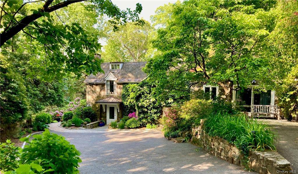 A charming, historic stone cottage originally designed in the 1920s by famous architect Ernest Flagg, this beautifully renovated and meticulously maintained 4 bedroom home including cozy, attached guest cottage with ...