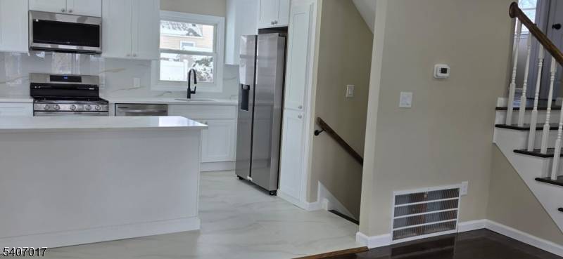 This charming 4 bedroom, 2 full bath split level home in the heart of Sayreville, New Jersey, offers the perfect blend of suburban tranquility and urban convenience.