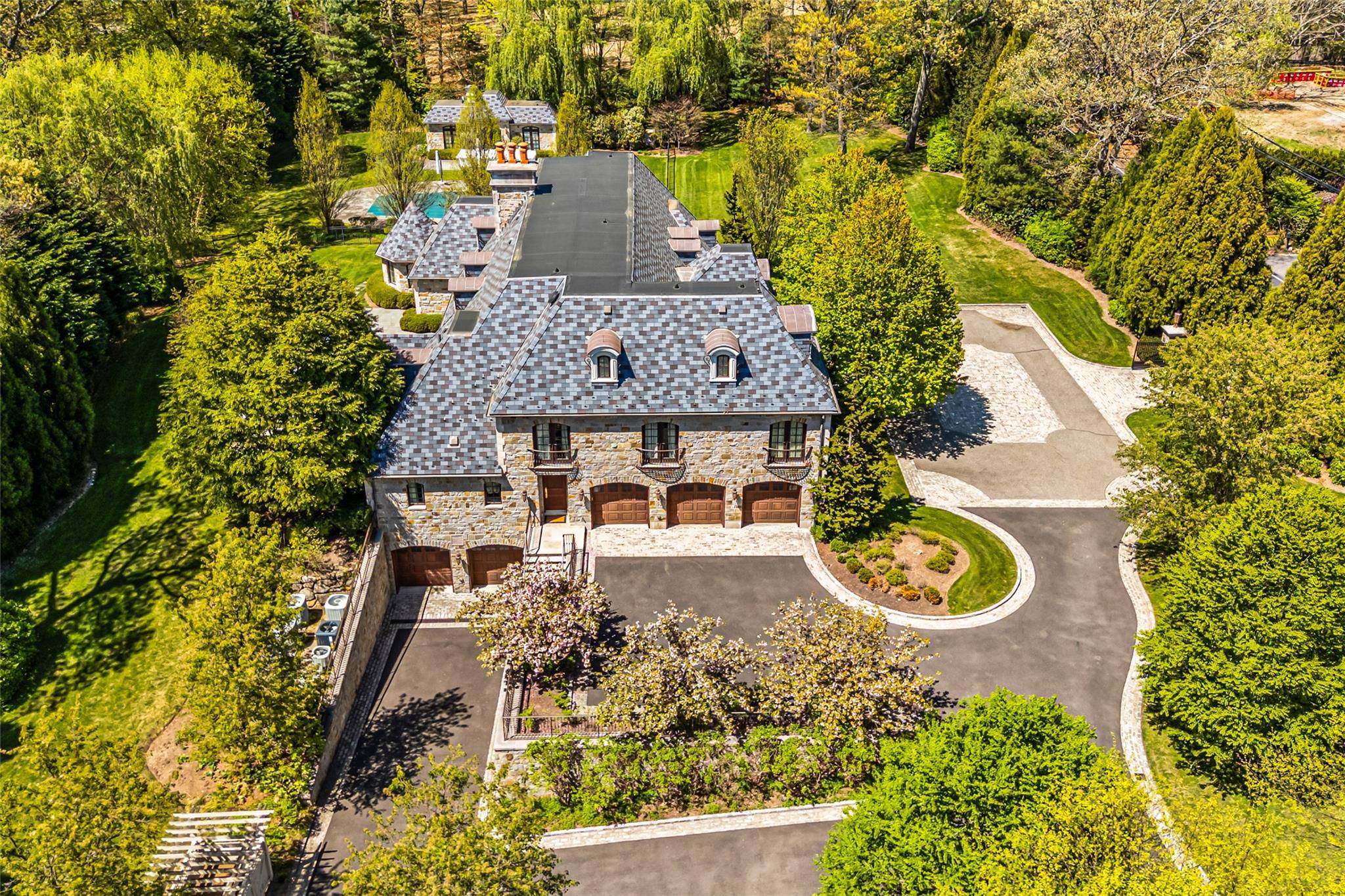 This grand, gated estate blends timeless elegance with modern convenience, showcasing meticulous European craftsmanship throughout.