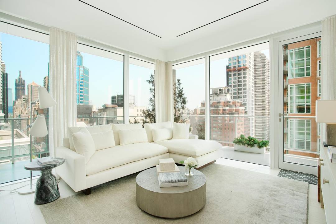 This spacious, corner 1, 416 square foot two bedroom, two and a half bath residence features a deep wraparound terrace overlooking Central Park, and western views of the Midtown skyline.