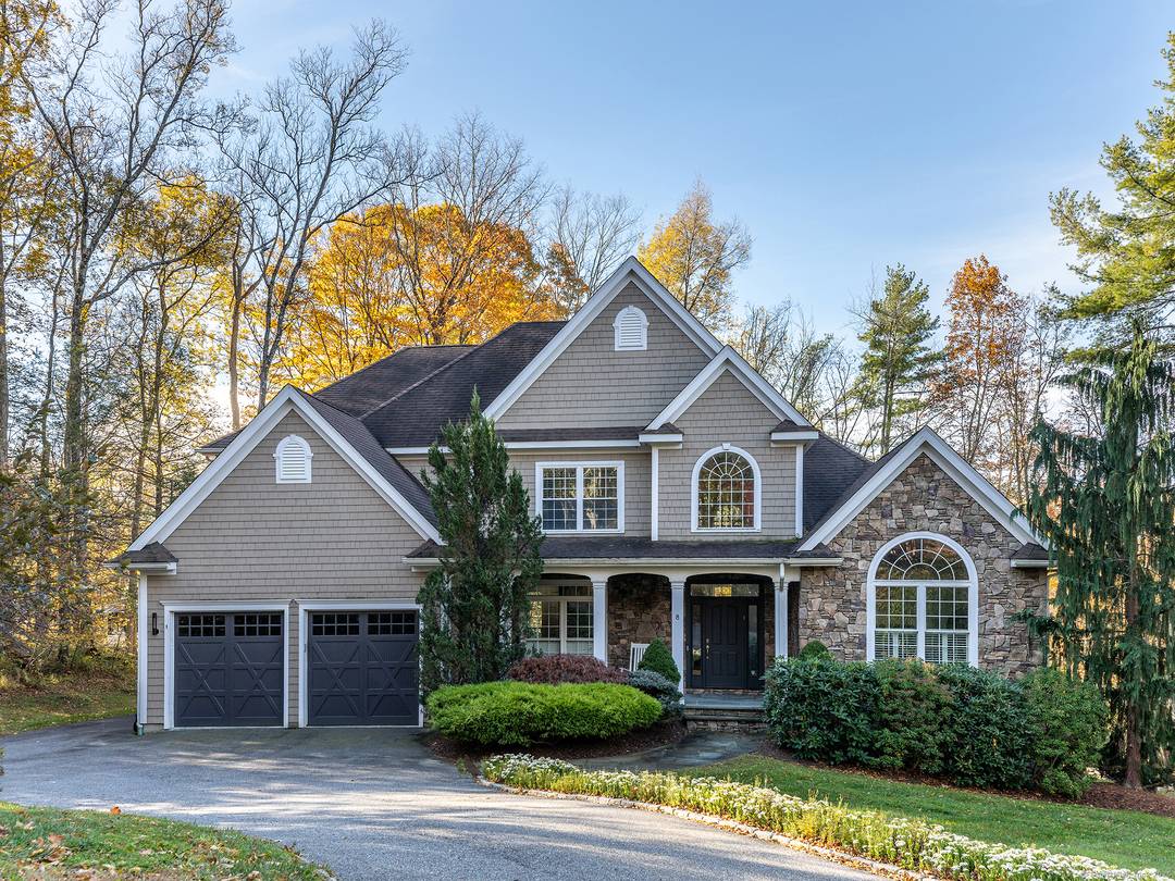Steps to an association beach and minutes to the clubhouse, this turnkey Woodridge Lake home delivers space, function, and four season amenities.