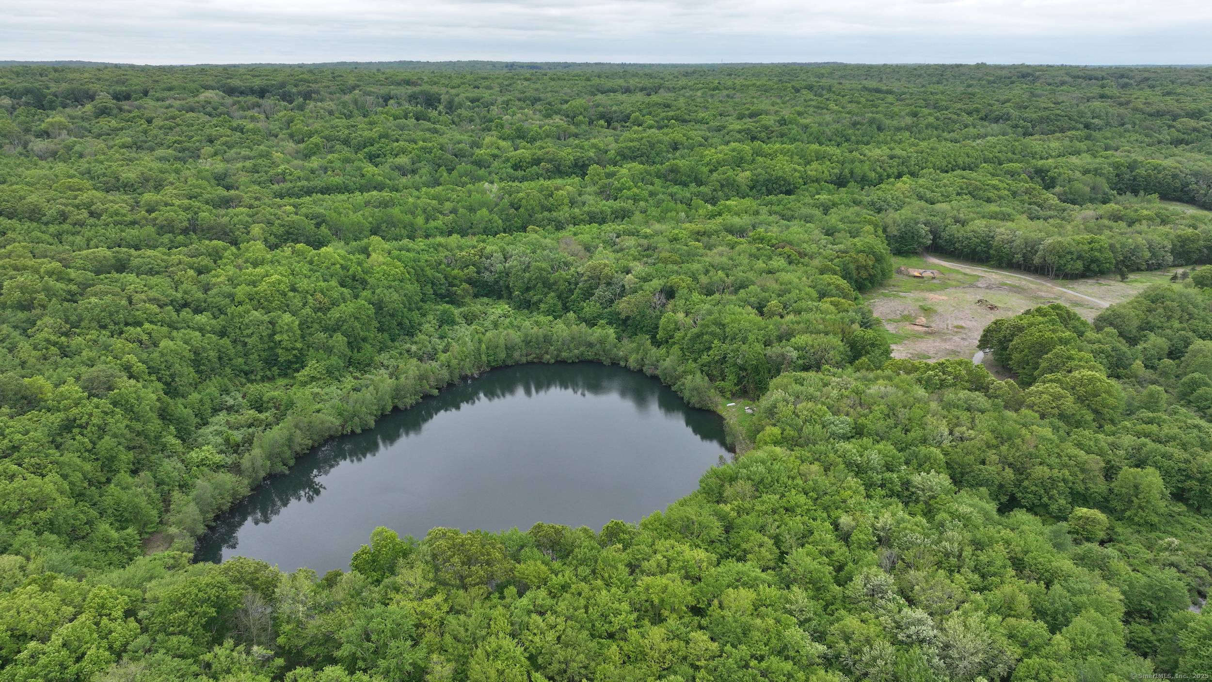 Welcome to 40 Caverly Mill Road, where nearly 86 acres of unspoiled natural beauty await.