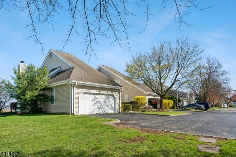 Enjoy stunning and breathtaking UNOBSTRUCTED NYC SKYLINE views from this contemporary bright and quiet END UNIT townhome with 2 car garage in gated Eagle Ridge.