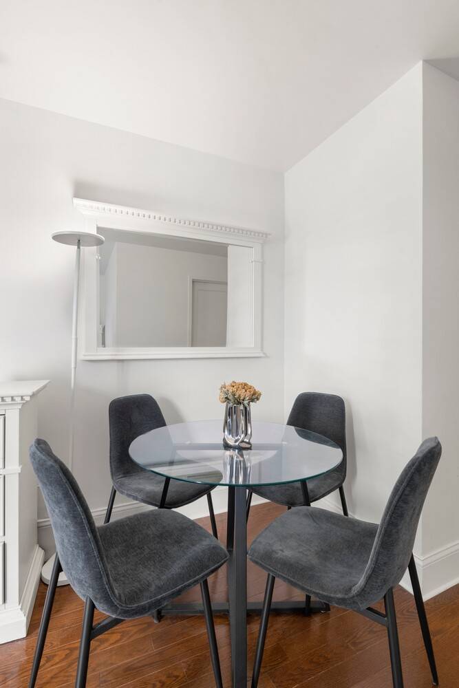 Apartment 5F offers a thoughtfully updated alcove studio with modern finishes throughout.