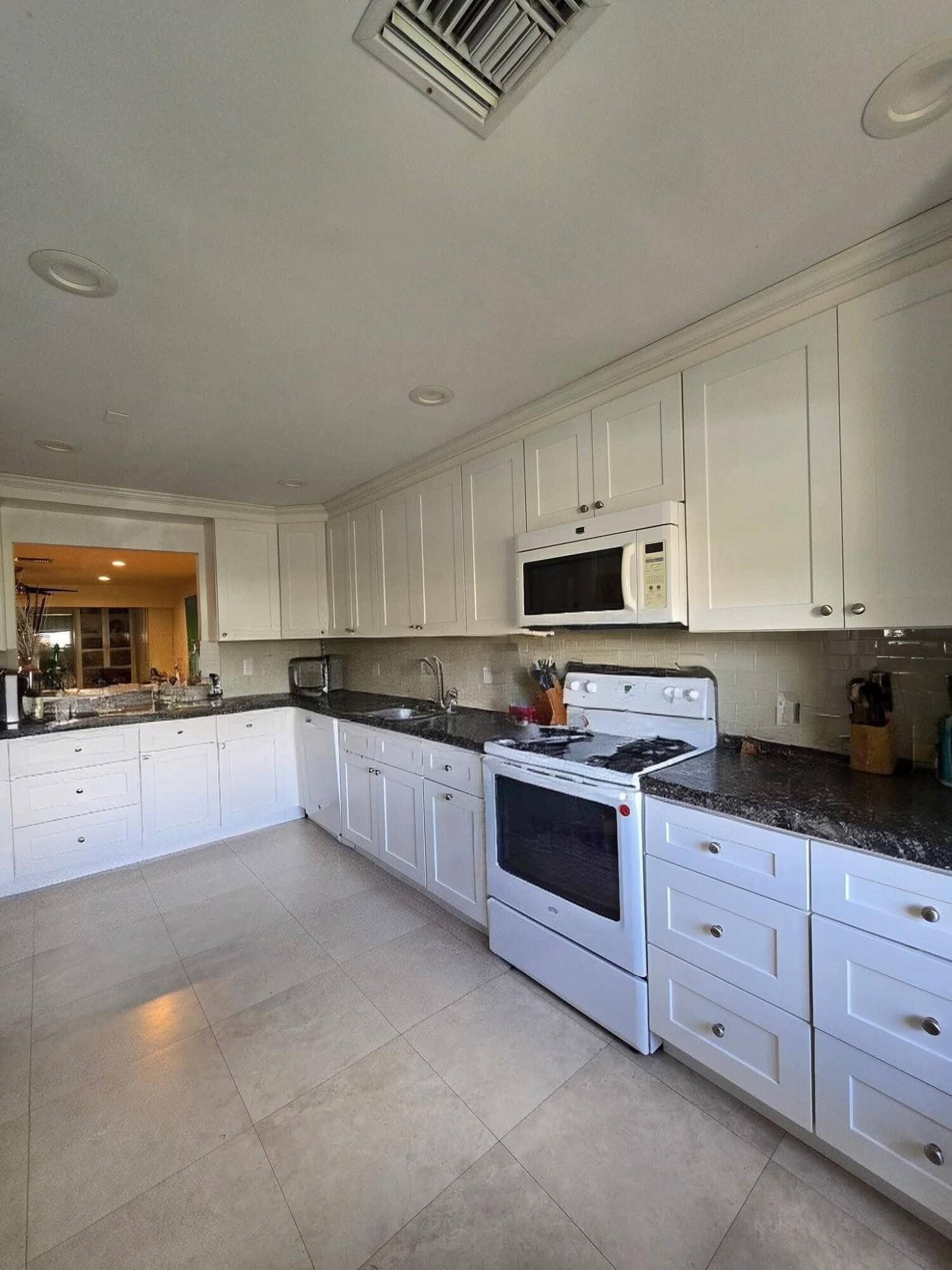 Beautifully updated 2 2 corner villa in the desirable 55 community of Pines of Delray North.
